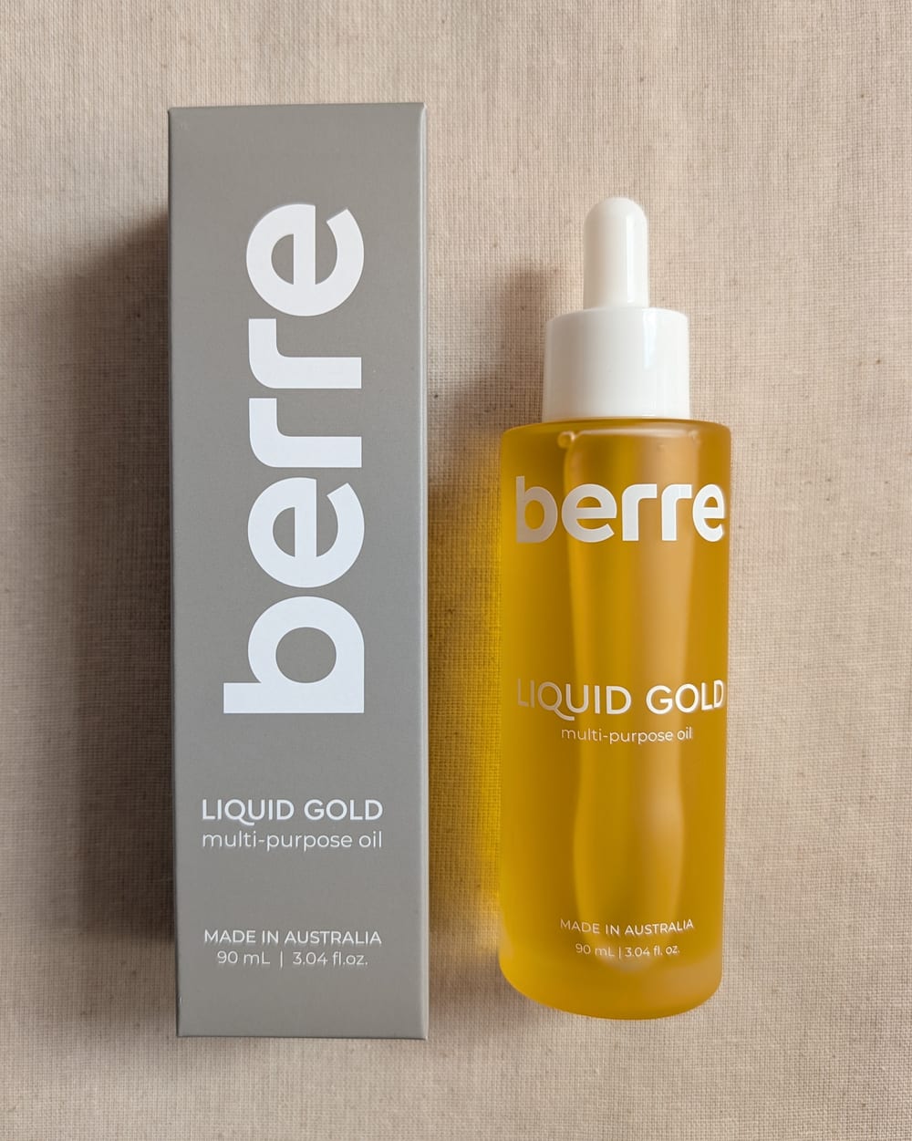 Berre Liquid Gold 90ml multi-purpose oil in a glass dropper bottle beside its box